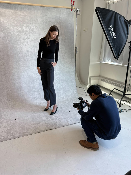 Model wearing Astorie's slim straight pants in the color Brooklyn Charcoal